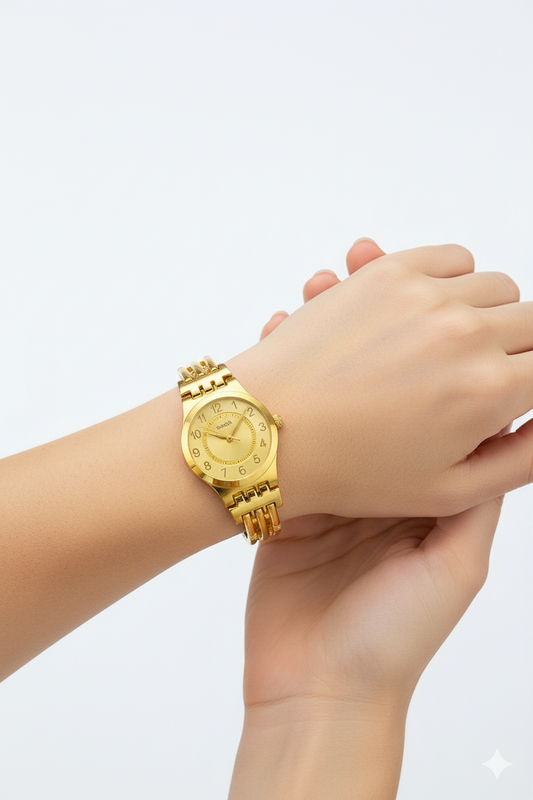 Montre Femme Swatch Dorée Élégante